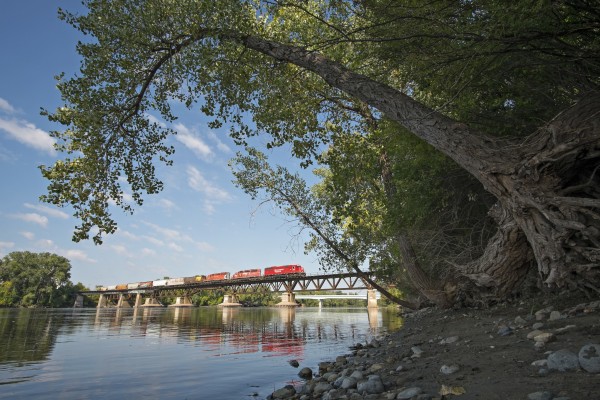 Canadian Pacific eastbound mixed freight train crossing the Mississippi River on the Camden Bridge in Minneapolis, Minnesota, on the morning of September 17, 2014.