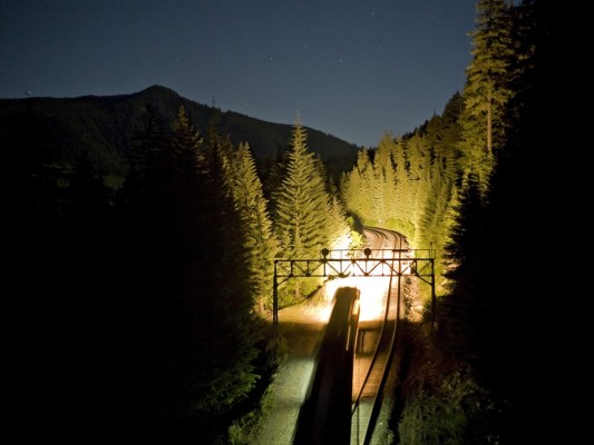 Union Pacific's Hinkle to Roseville freight train (QHKRV) lighting up the tracks at Cruzatte, Oregon, as it storms up the Cascades towards Pengra Pass.