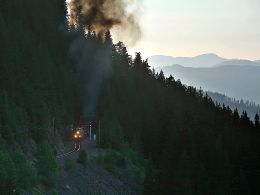 Struggling locomotives on Union Pacific's Eugene to Roseville freight train (QPWRV) cast a pall of exhaust smoke into the otherwise clear sky at Cruzatte, Oregon.