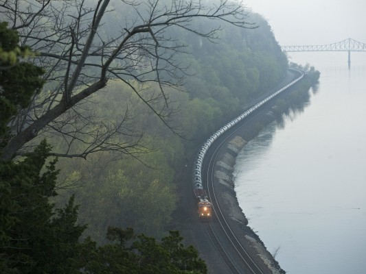 BNSF westbound empty unit oil train along the Mississippi River at Savanna, Illinois, at sunrise on March 25, 2012.