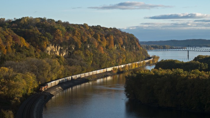 BNSF Railway westbound autorack train passing the palisades of the Mississippi River near Savanna, Illinois, on the evening of October 18, 2014.