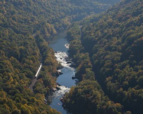 Amtrak's eastbound "Cardinal," train no. 50, heads up the New River near Nuttallburg, West Virginia, on a bright October morning in 2007.