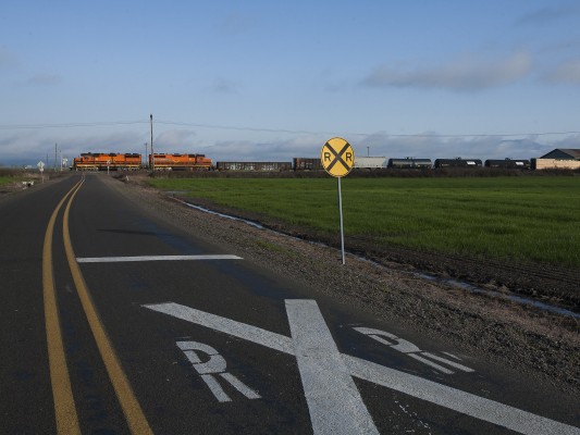 Portland and Western's American Turn rolls north through a road crossing on the Oregon Electric District north of Junction City on February 17, 2010.