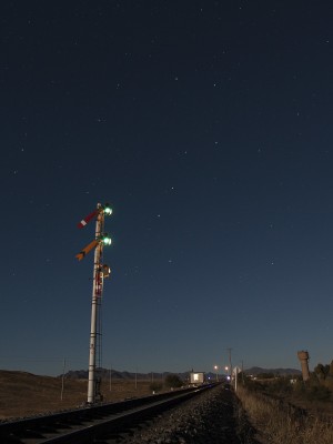 The Big Dipper rises above the distant signal at Gulumanhan, Inner Mongolia, China, on the Jitong Railway in October 2005.