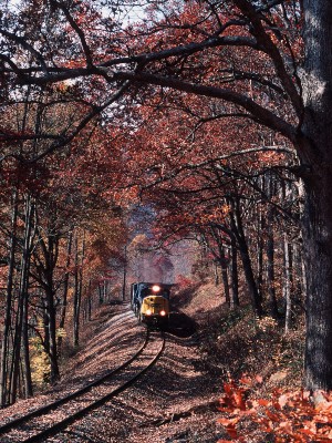 On a late October afternoon, a CSX SD70MAC leads an empty coal train for the Evergreen Mine near the end of the Cowen Subdivision in central West Virginia.