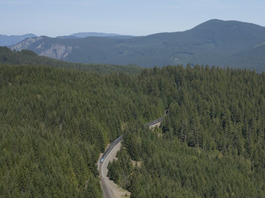 Amtrak passenger train no. 14, the northbound <i>Coast Starlight</i>, descends the former Southern Pacific grade in the Cascade Mountains between Fields and Wicopee on May 16, 2009.