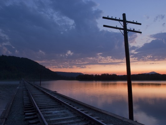 Looking down the St. Maries River Railroad's former Milwaukee Road main line across Benewah Lake in northern Idaho as the sun sets on a July day in 2007.