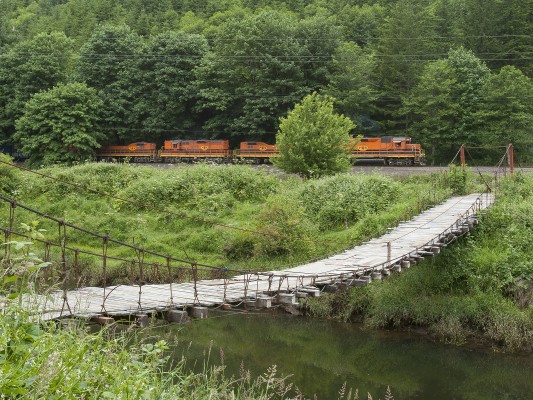 Portland and Western's Toledo Hauler passes a spindly-looking suspension bridge over the Yaquina River on June 25, 2008. Remarkably, someone drove an 80s-vintage car across this just moments later as I was packing up. Wish I'd been shooting video!