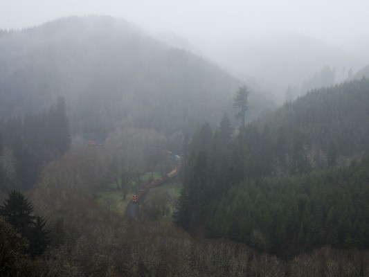 Portland and Western's Toledo Hauler cuts through dense fog and misty on a gloomy morning in the Coast Range mountains on March 31, 2011.