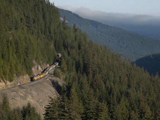 An empty ballast train climbs the Cascades heading south at Cruzatte, Oregon, on the morning of May 23, 2009.