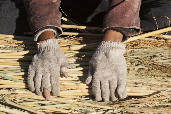 The weathered hands of a broom maker along the Jitong Railway near Chagganhada, Inner Mongolia, China, in October 2005.