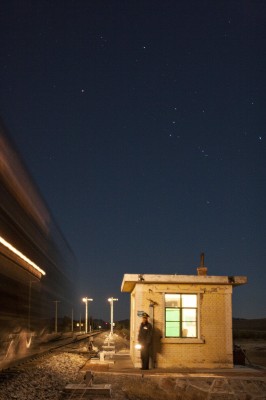 Orion rides high above the west end of Chagganhada siding as an eastbound Jitong Railway freight train passes on an October night in 2005.