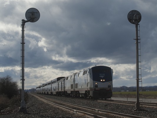Amtrak's <i>Coast Starlight</i> passenger train no. 14 rolls north past Alford Siding as clouds swirl above the Willamette Valley near Harrisburg, Oregon, on March 2, 2009.