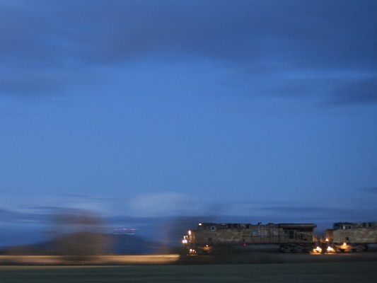 Union Pacific Railroad mixed freight train rolling north in the Willamette Valley at dusk in a 1/4-second panned shot on February 9, 2009.