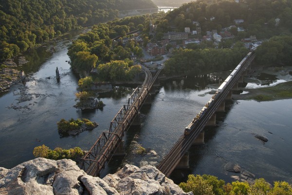 CSX eastbound mixed freight train crossing the Potomac River at Harpers Ferry, West Virginia, as seen from Maryland Heights just before sunset in October 2007.