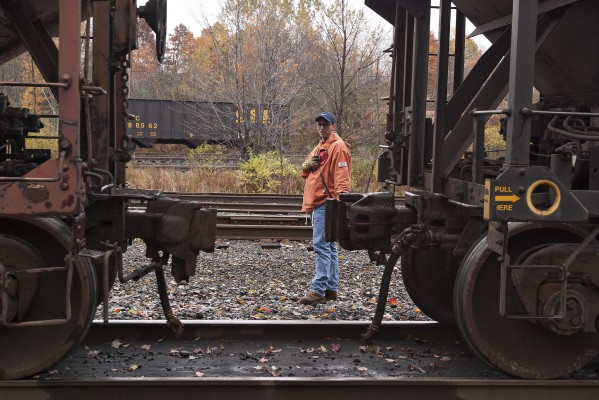 CSX conductor Jeff Conrad puts his coal train together in Cowen, West Virginia, on a dreary fall morning in 2004.