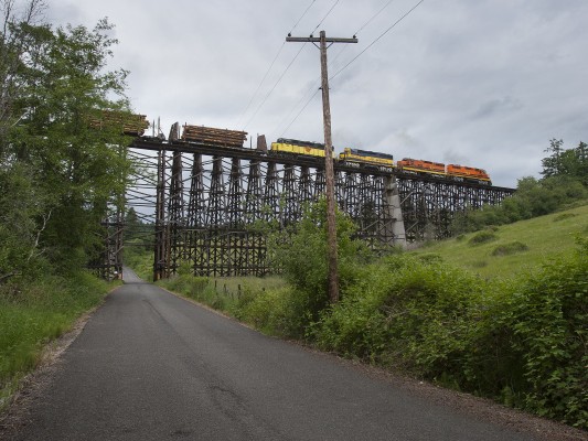 On June 11, 2008, Portland and Western's Harbor Turn crosses Holcomb Creek near Hillsboro, Oregon, on the largest wooden railroad trestle still in use.