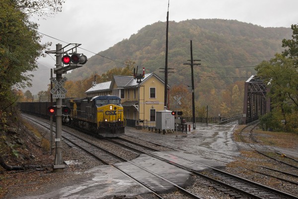 CSX westbound empty hopper train passing the former Chesapeake & Ohio depot at Thurmond, West Virginia, on a wet October day in 2007.