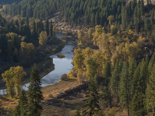 Caboose 997 brings up the rear of the St. Maries River Railroad's inbound Clarkia Logger with more than fifty loads of Idaho timber at Mashburn, just before the sun sets on a perfect October day in 2008. This would be the last train I would see on the railroad's branchline up its namesake river. The Potlatch mill in St. Maries got a new manager, who opted to bring logs to the mill by truck instead of by rail, and the line was abandoned in 2009. The railroad still switches the mill in St. Maries and hauls finished lumber to the Union Pacific interchange in Plummer, but without the log trains, it just isn't the same.