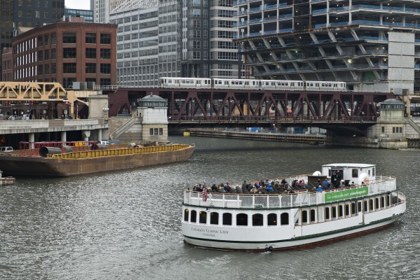 Siteseeing boat and Pink LIne train at Lake Street on the Chicago River.