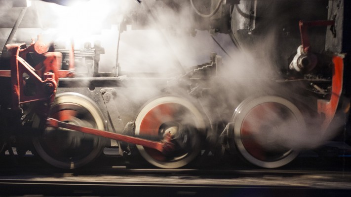 The tiny driving wheels of thirty-inch-gauge 0-8-0 C2 steam locomotive of the Huanan Forestry Railway spinning at Lixin on the morning of September 29, 2005.