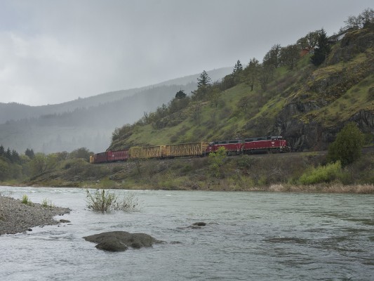 Central Oregon and Pacific Railroad freight train following the South Umpqua River at Myrtle Creek, Oregon, on April 8, 2010.