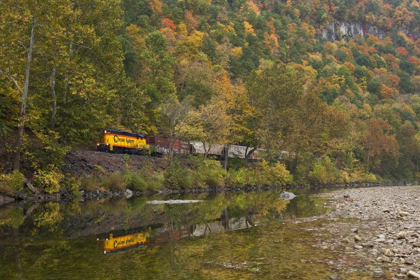 The South Branch Valley's Chessie-painted GP9, no. 6240, leads a short train northward along the railroad's namesake river shortly after departing Petersburg, West Virginia. The water level is low due to drought conditions that persisted from mid-August to mid-October.