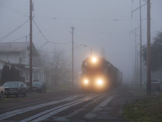 Portland and Western's American Turn rolls down Fourth Street in Harrisburg, Oregon, on the foggy morning of January 16, 2009.