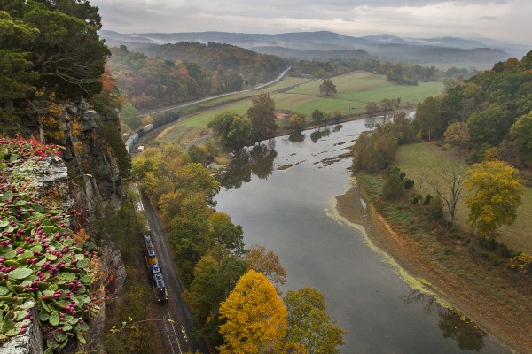 South Branch Valley northbound freight train running along its namesake river at Wapocomo between Romney and Green Spring, West Virginia, on a misty fall day in 2007.