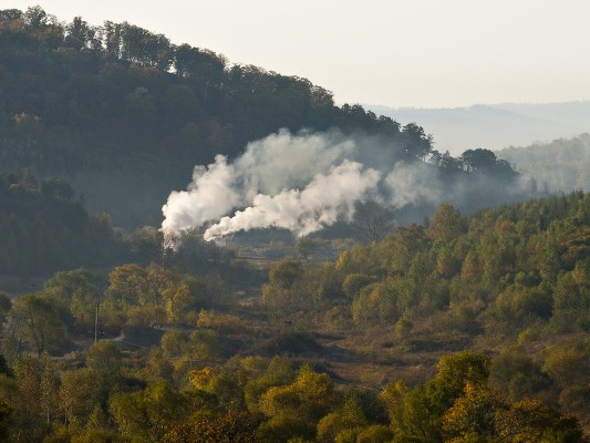 Two C2 0-8-0 steam locomotives prepare to depart Lixin with an eight-car coal train on the morning of September 27, 2005.