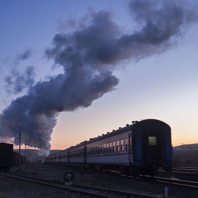 The Jitong Railway's morning passenger train departs Lindong at dawn in November 2005.