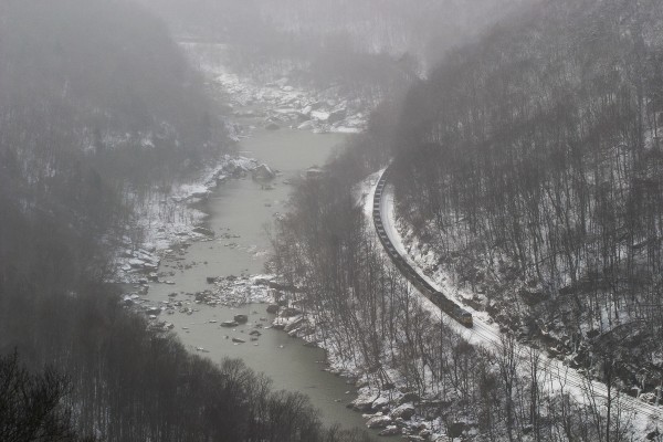 CSX westbound empty coal train in the western end of the New River Gorge near Gauley Bridge, West Virginia, as light snow falls in 2005.