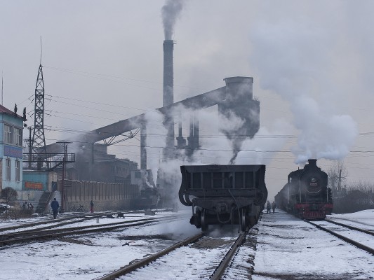 SY-class 2-8-2 steam locomotives power coal trains at the Chengzihe Dongchang yard on the Jixi Coal Railway.