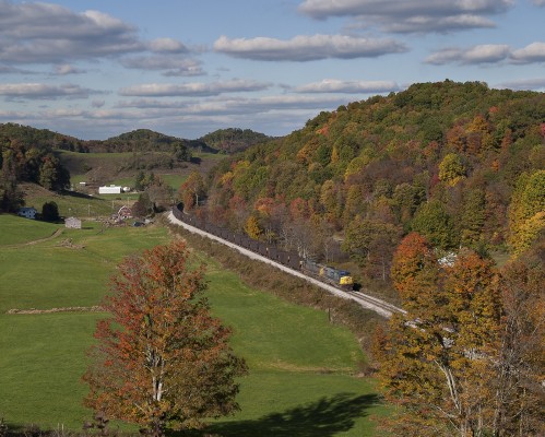 CSX empty coal train passing a farm in the mountains near Adrian, West Virginia, on a bright October afternoon in 2004.