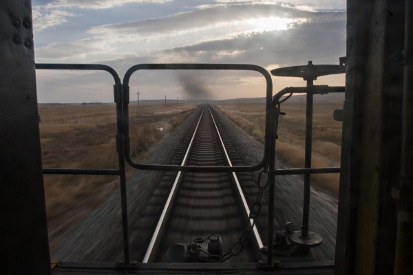 View out the back of a caboose on a Jitong Railway westbound freight train near Chagganhada.