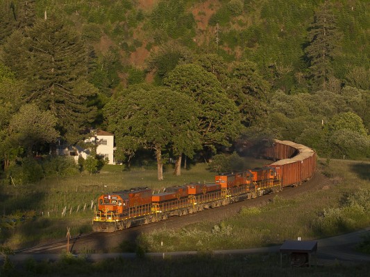 Portland and Western's Toledo Hauler rolls through Harris, Oregon, just before the sun sets in the Coast Range Mountains on June 14, 2008.