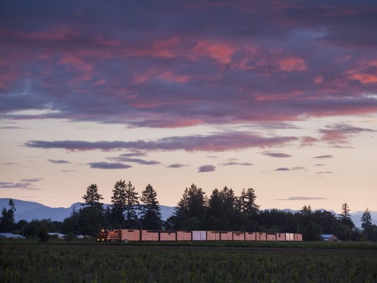 The clouds glow at sunset about Whiteson, Oregon, as Portland and Western's Willamina Turn heads home with fourteen loaded lumber cars on May 27, 2010.