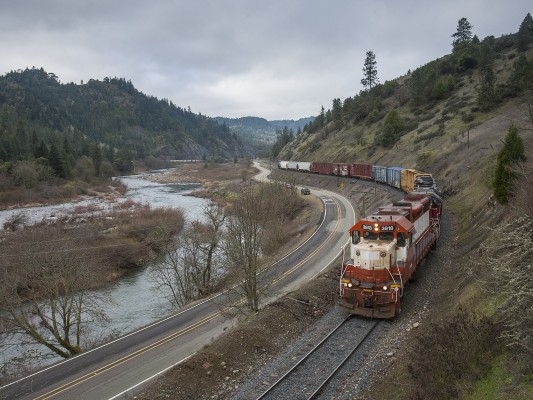 Central Oregon and Pacific Railroad freight train rolling south along the South Umpqua River near Myrtle Creek, Oregon, on February 8, 2010.