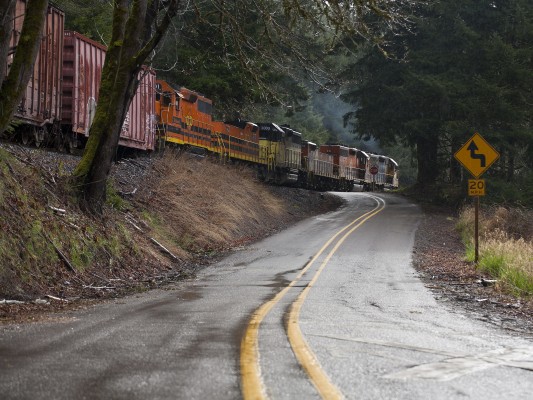 Portland and Western's Toledo Hauler rolls east along Nashville Road behind four locomotives and two slugs between Nortons and Nashville, Oregon, on March 26, 2011.