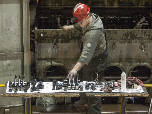 Portland and Western shop worker tends to one of the railroad's locomotives inside the Albany shop on May 8, 2009. Shot on assignment for <i>Locomotive</i> magazine.
