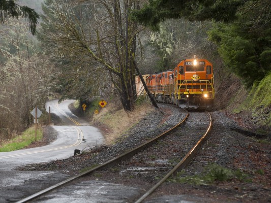 Portland and Western's Toledo Hauler runs east through the Coast Range along winding Nashville Road between Nortons and Nashville on March 31, 2011.