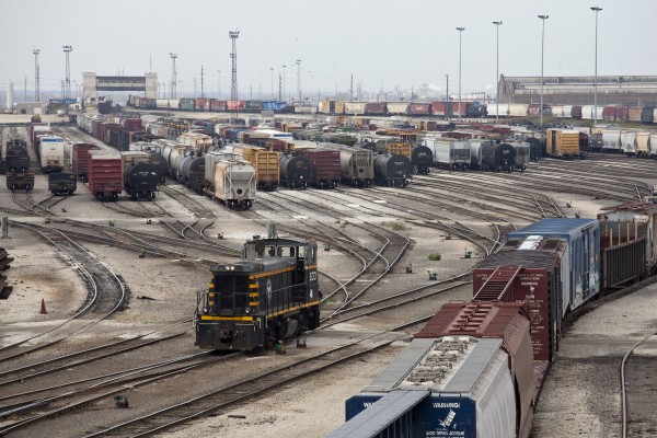 Belt Railway of Chicago switcher heading into the bowl at the BRC's Clearing Yard in Bedford Park, Illinois, on November 6, 2011. The tower for the yard's double hump is visible in the distance, where two six-axles have about finished shoving a cut of cars over the hump.