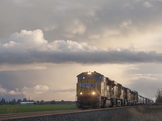 Clouds roll above the Willamette Valley as Union Pacific's Roseville-Portland Terminal freight train heads north near Tangent, Oregon, on November 11, 2009.