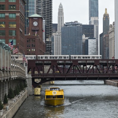 Chicago Water Taxi and Brown Line train at the Wells bridge over the Chicago River.