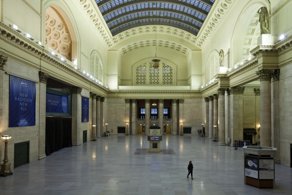 A lone passenger walks through the empty Great Hall of Chicago Union Station at dusk on November 6, 2011.