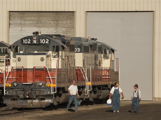 The three-man crew of the St. Maries River Railroad's Clarkia Logger walks back to the depot in St. Maries, Idaho, after tying up their locomotives at the engine shop. Conductor Pat, brakeman Scooter, and engineer Keith all hired out with the Milwaukee Road in the 1970s.