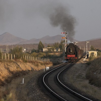 Just before sunset, a westbound Jitong Railway freight train departs Chagganhada.