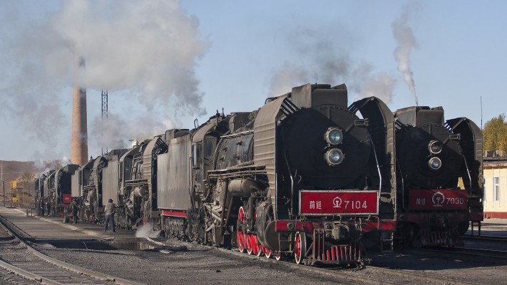 The Jitong Railway ready tracks in Daban, Inner Mongolia, China, are filled with QJ steam locomotives for several eastbound freight trains on November morning in 2005.