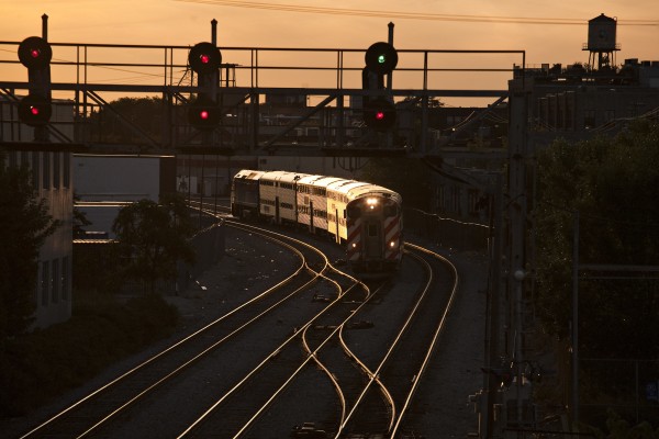 Inbound Metra commuter train coming into Chicago Union Station at North Halstead Street at sunset on September 15, 2011.