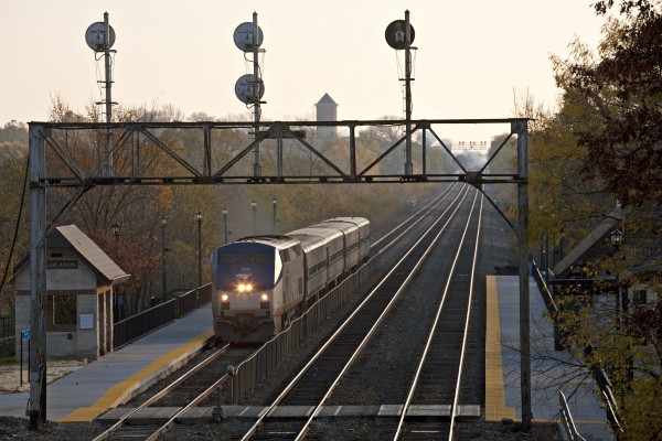 Amtrak westbound passenger train no. 381, "Carl Sandberg," passing the Highlands Station in Hinsdale, Illinois, on November 6, 2011. The CB&Q signal bridge is just days from replacement.